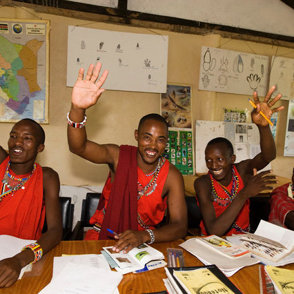 Indigenous Maasai people in class at the Wildlife Tourism College in Kenya