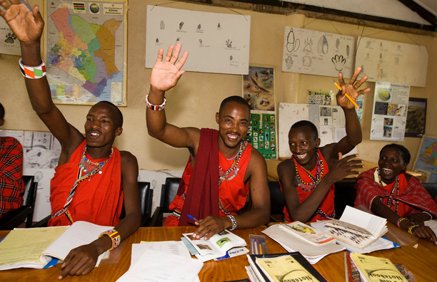 Indigenous Maasai people in class at the Wildlife Tourism College in Kenya.